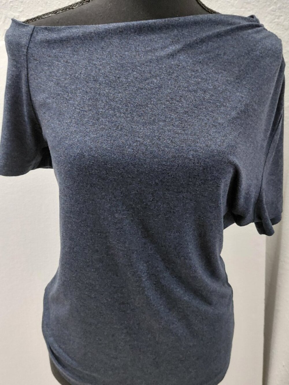 LNA CLOTHING blue heathered, short-sleeve top with an asymmetrical, wide necklin